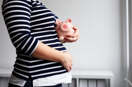 1540484510_bigstock-pregnant-woman-with-piggy-bank-223427311